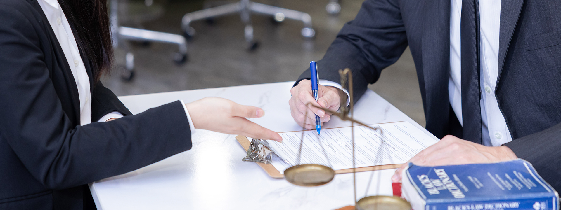 image of lawyer guiding and managing the documentation of legal papers