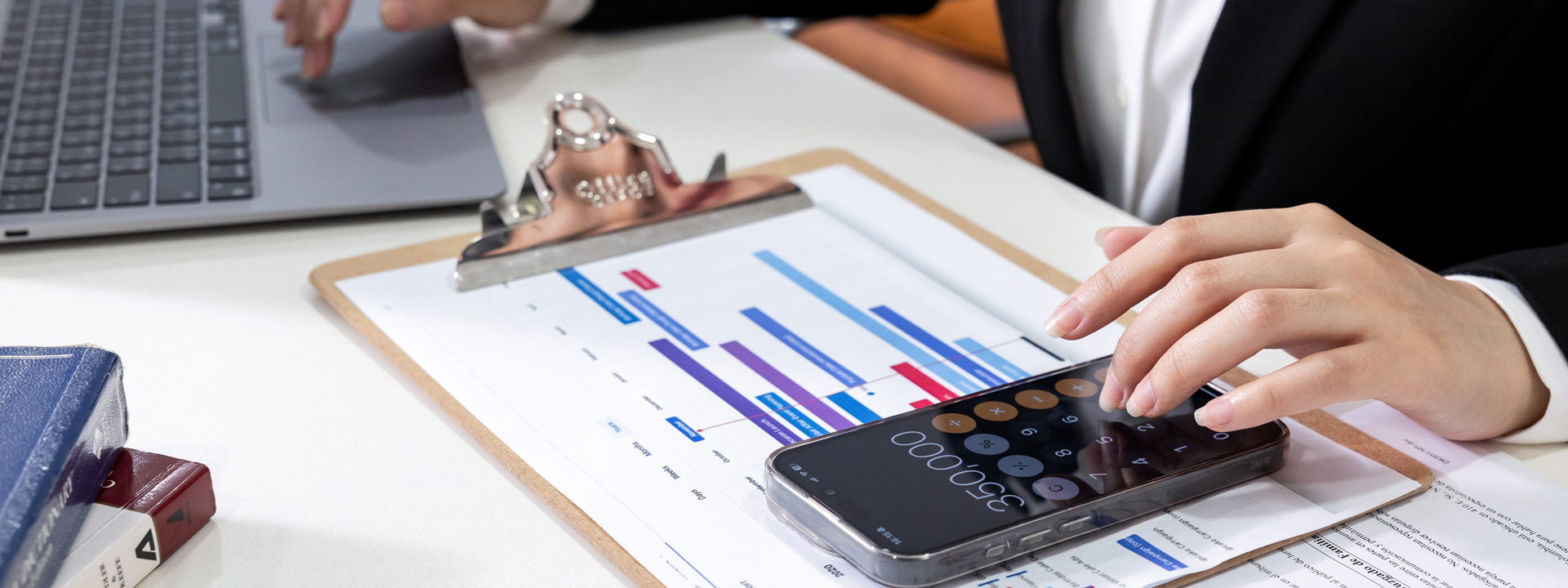 Lawyer calculating the timeline of a case on a spreadsheet and calculator